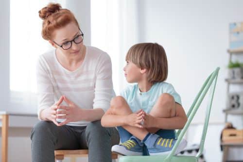 Young Boy Talking to Woman Guardian ad Litem - Ashley Wood Law, P.C.