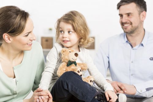 Child Support Concept - Family with daughter in forefront