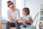 Young Boy Talking to Woman Guardian ad Litem - Ashley Wood Law, P.C.