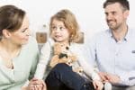 Child Support Concept - Family with daughter in forefront
